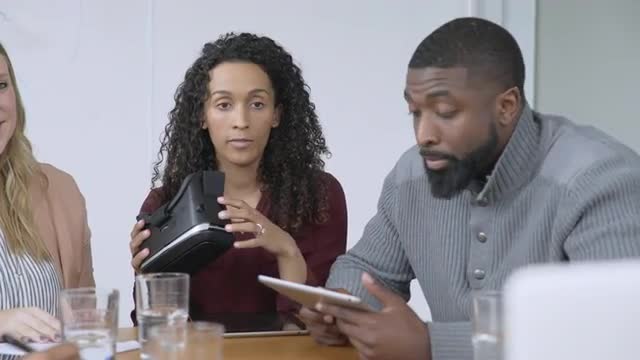 Business people video chatting about virtual reality goggles