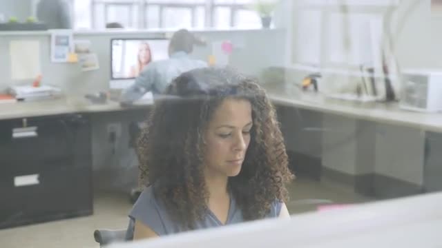 Business people working in busy startup office
