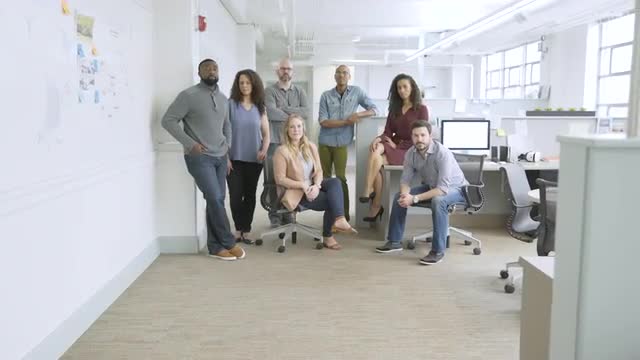 Portrait of confident business people in startup office