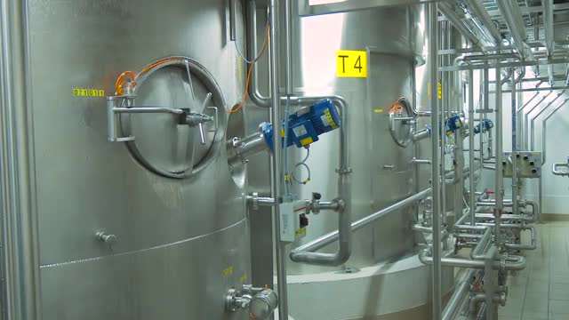 Steel tanks in the interior of a modern factory.