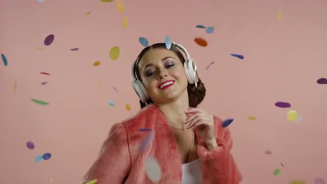 Woman dancing with confetti