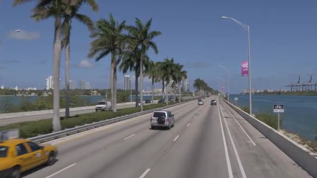 Travelling on MacArthur Causeway toward South Beach, Miami, Florida, United States of America, North