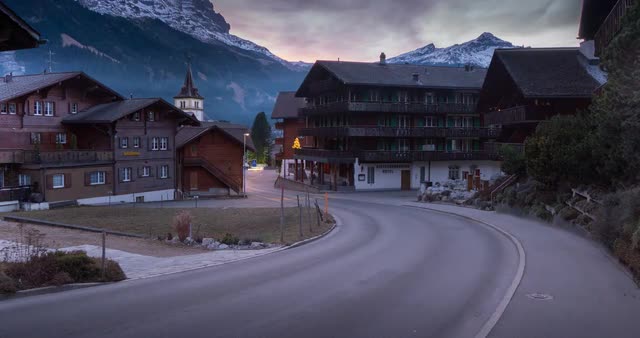 Traffic and Church in Grindelwald village, Jungfrau region, Bernese Oberland, Swiss Alps, Switzerlan