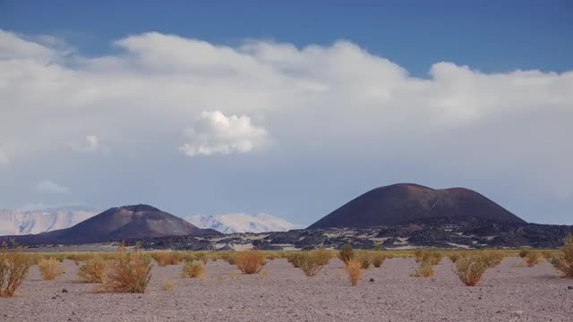 Volcanoes, bushes and clouds