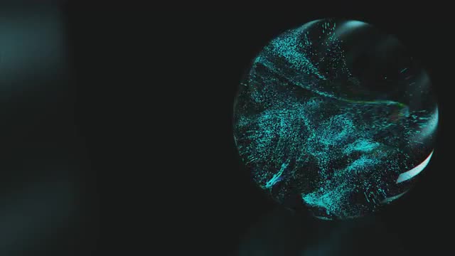 Color changing / flashing particles swirl around inside a glass sphere.
