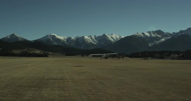 Plane taking off in front of mountains - TRAVELING