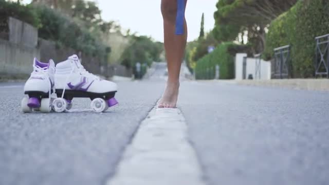 Barefoot woman on asphalt road
