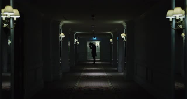 Male standing in end of corridor