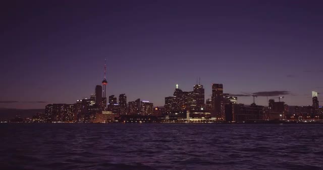 Establishing shot of the Toronto skyline at night.