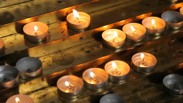 Lighted candles on table