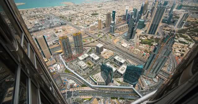 Timelapse from viewpoint on a sunny day with cityscape and ocean in view