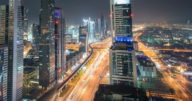 Timelapse from viewpoint at night with cityscape and traffic in view