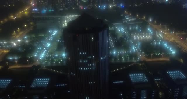 Aerial shot over Shanghai Science and Technology Museum at night