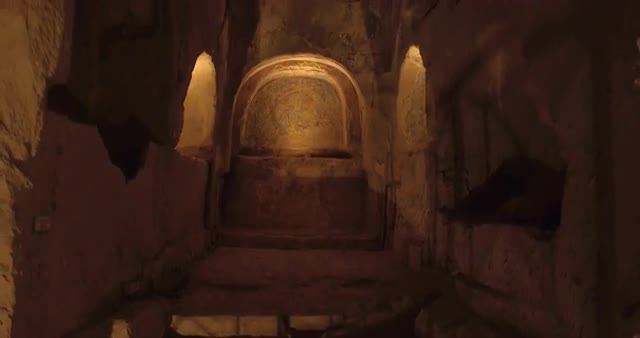 Video shot in Catacombe di Napoli / Naples Catacombs with lights and carvings