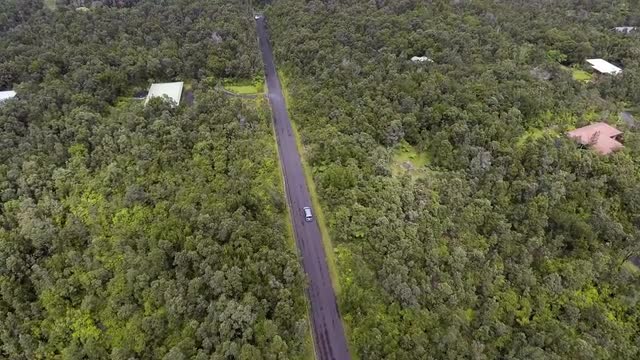 Wide Aerial View of a Van Driving in Hawaii 1