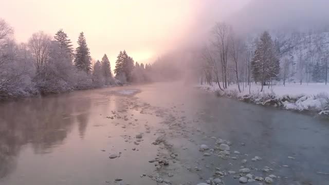 Flying low over the Soca River as the sun lights up the foggy mist