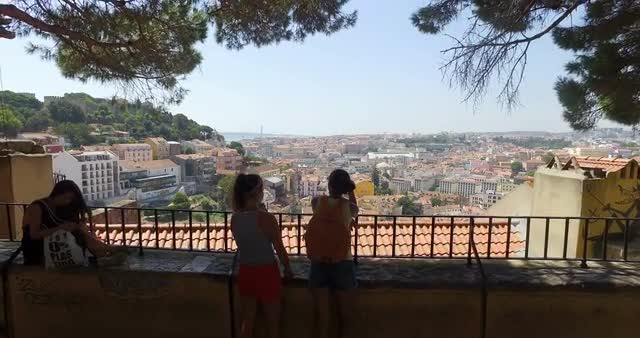 Video shot from amazing viewpoint on a sunny day with people and cityscape