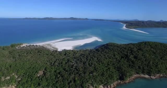 Aerial shot over Whitehaven Beach island on a beautiful day