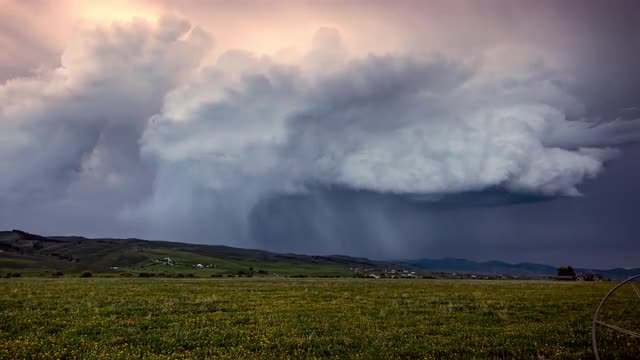 Time lapse of clouds rolling in rain storm over Wyoming landscape