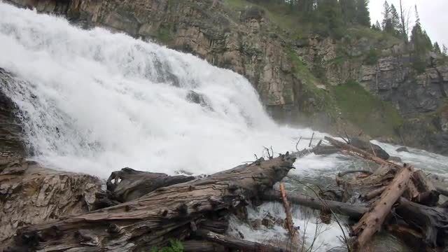 Waterfall flowing through canyon in slow motion during Spring runoff