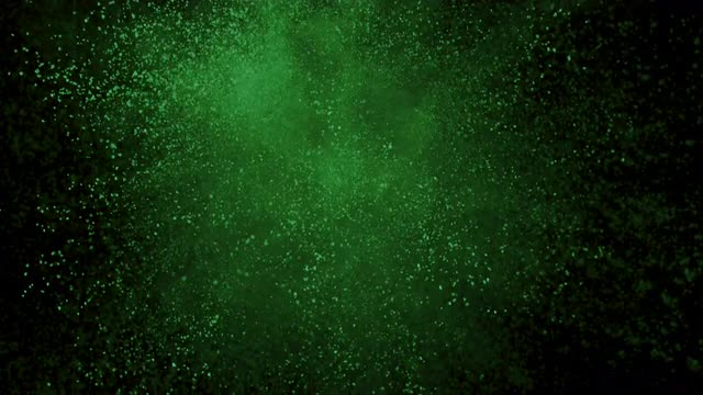 Green powder exploding on black background in super slow motion, shot with Phantom Flex 4K