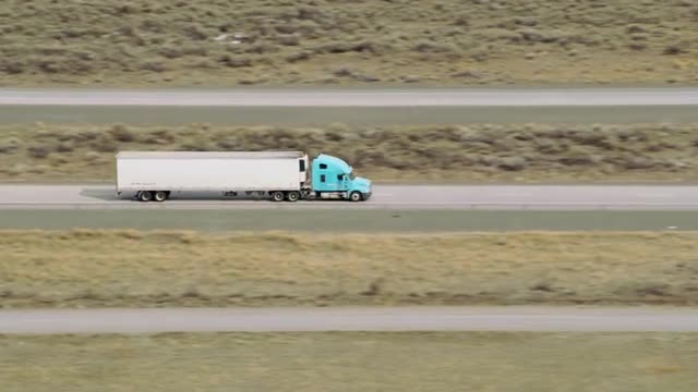 Aerial view of semi truck driving on highway