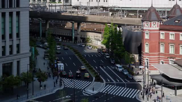 Timelapse view of pedestrians crossing road near Tokyo station, Tokyo, Japan