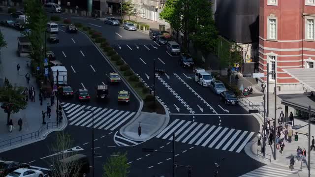 Timelapse view of pedestrians crossing road near Tokyo station, Tokyo, Japan