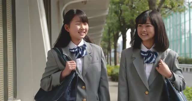Japanese school students walking downtown Tokyo