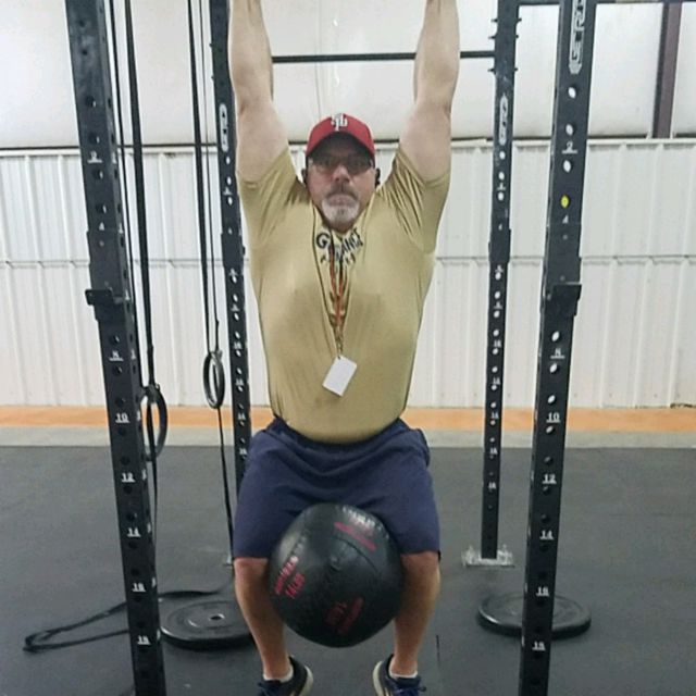 Weighted Knees To Chest - Exercise How-to - Workout Trainer by Skimble