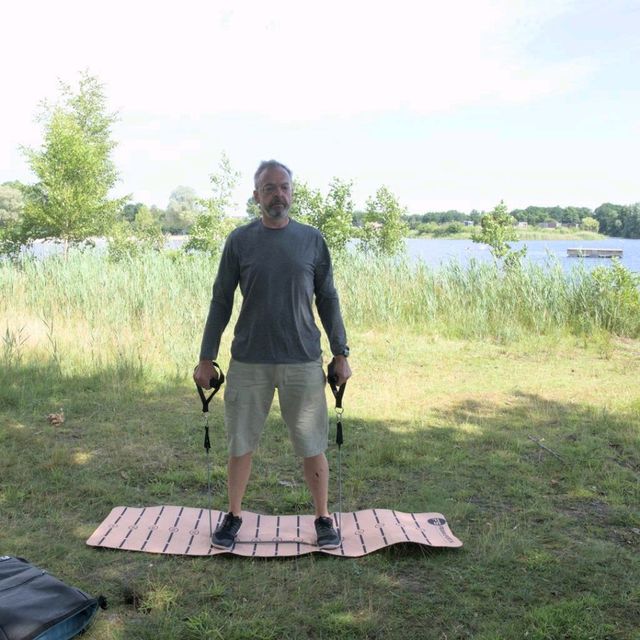 Bands Standing Chest Cross Over by Frank Roodenburg Exercise Howto Skimble