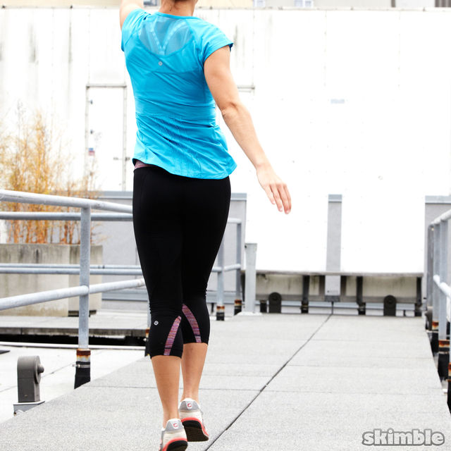 Skips with Backward Arm Circles Exercise Howto Workout Trainer by