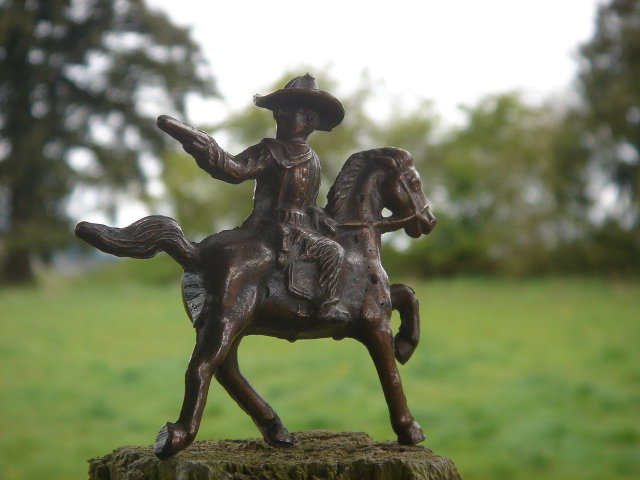 Bronze style Western Cowboy shooting a handgun while mounted on his  Galloping Horse__RARE Find in Miniature. SOLID CAST FIGURE Not Hollow__Excellent Condition. 