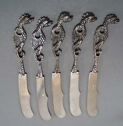 5 dragon handled butter spreaders.