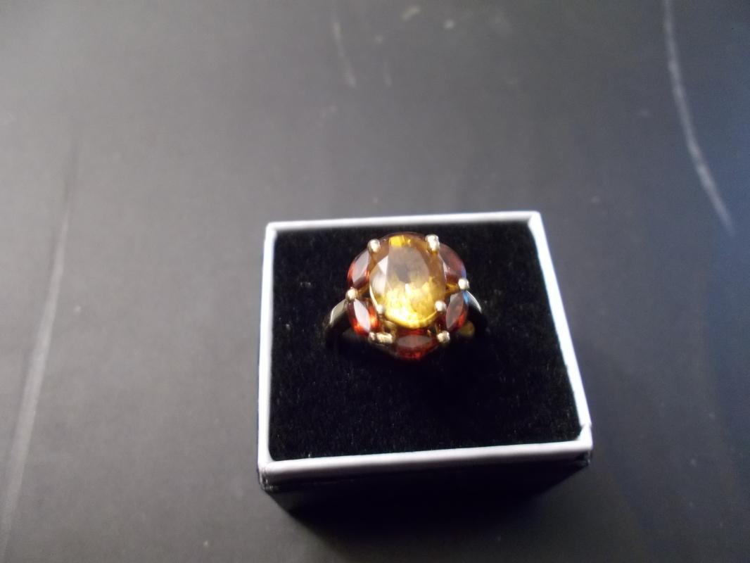 Ladies 14 Karat Yellow Gold Ring Containing One Oval Cut Citrine and Surrounded by Six Marquis Cut Madera Citrines