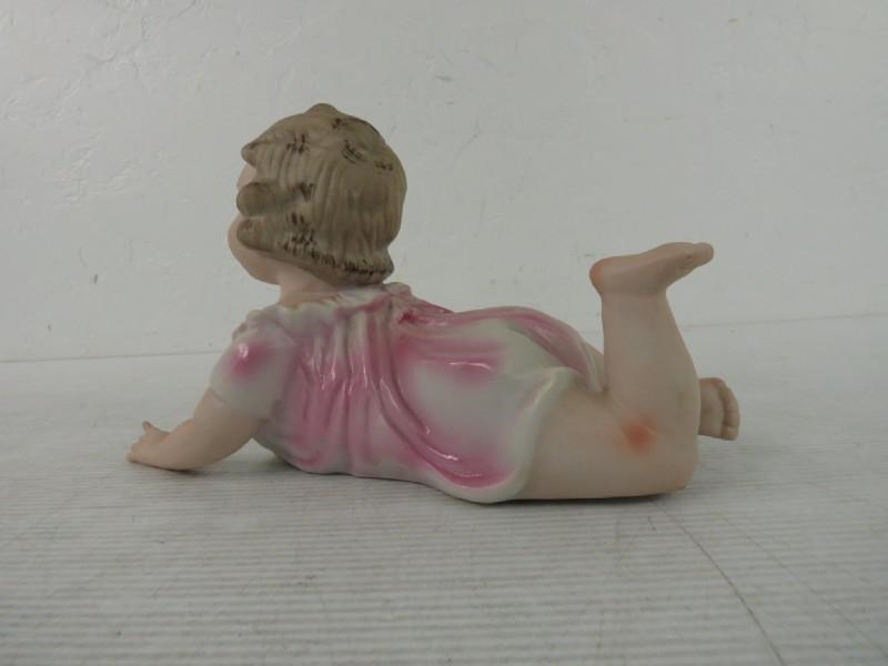 Piano Baby, Bisque Porcelain Crawling Baby in Pink Dress