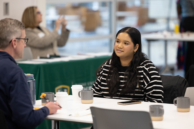 Photo of a mentor and a mentee having coffee