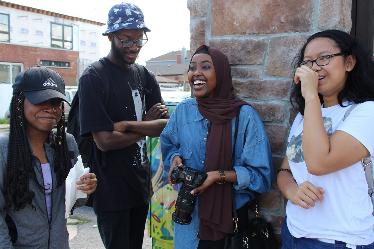 Four friends laughing