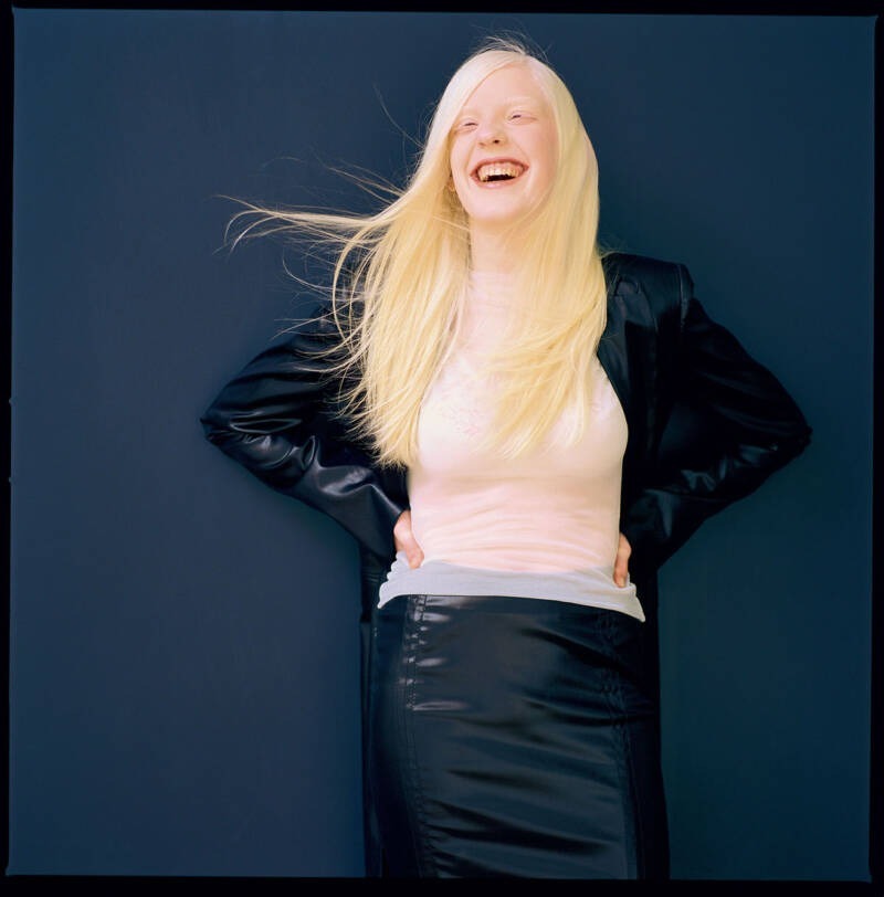 A person with long blonde hair AI-generated content may be incorrect.