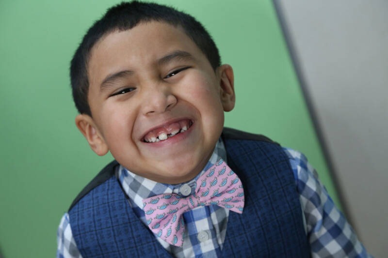 A close-up of a child smiling AI-generated content may be incorrect.