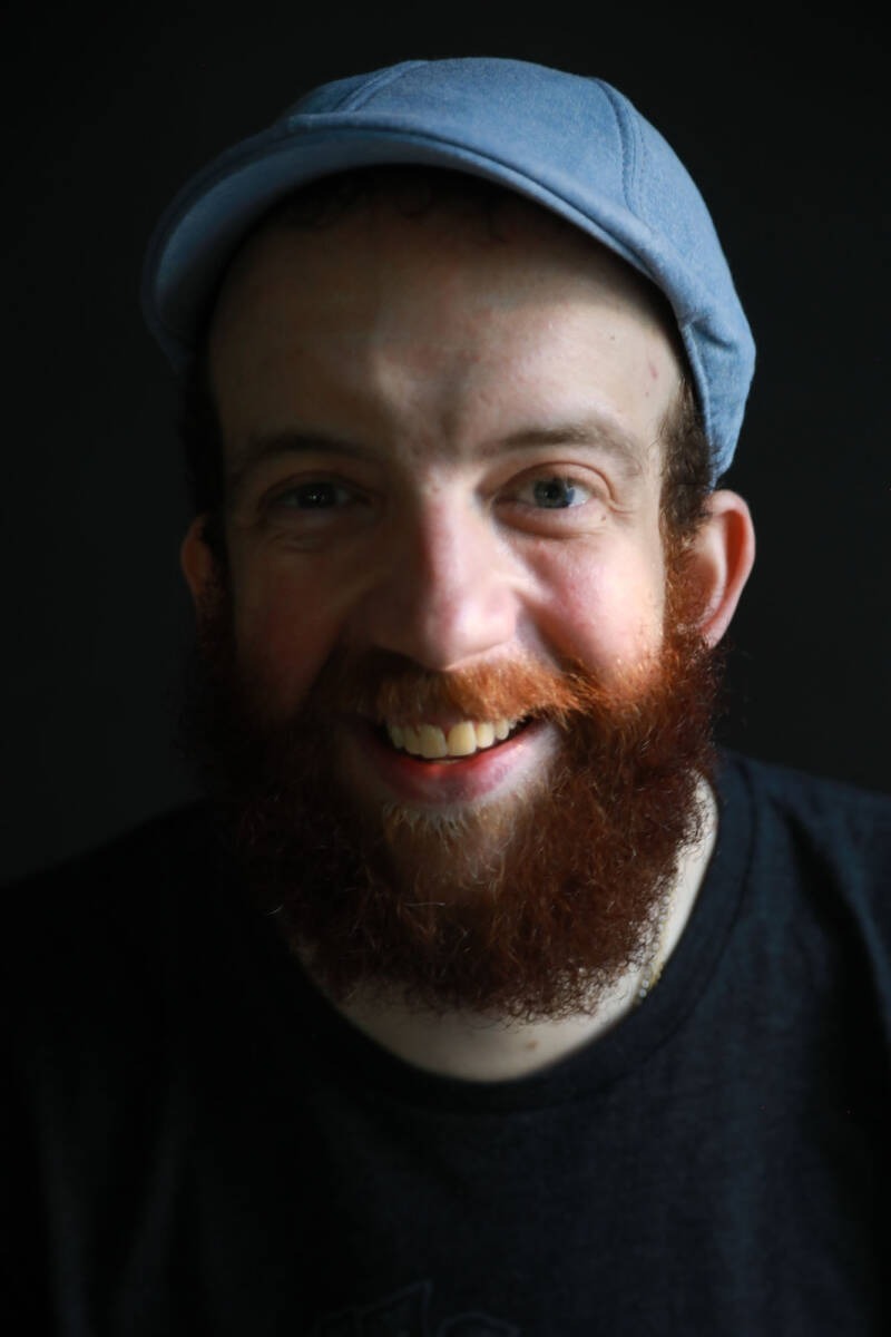 A person with a beard and a hat AI-generated content may be incorrect.
