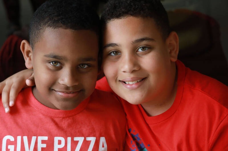 A close-up of two boys AI-generated content may be incorrect.