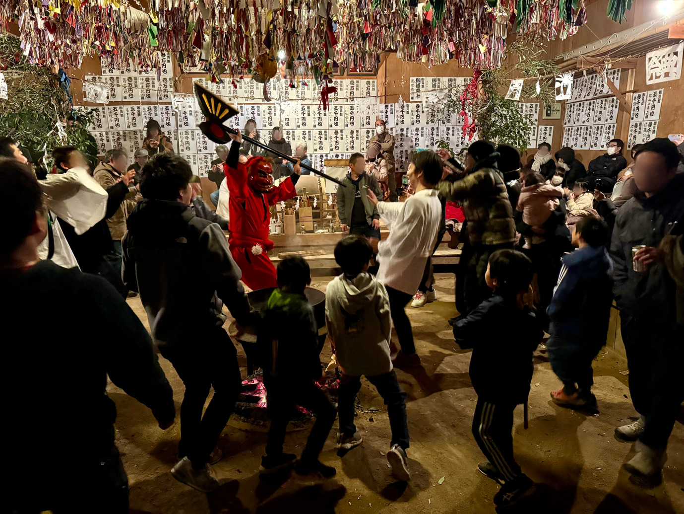 A group of people around a room with a person in a garment holding a spear AI-generated content may be incorrect.