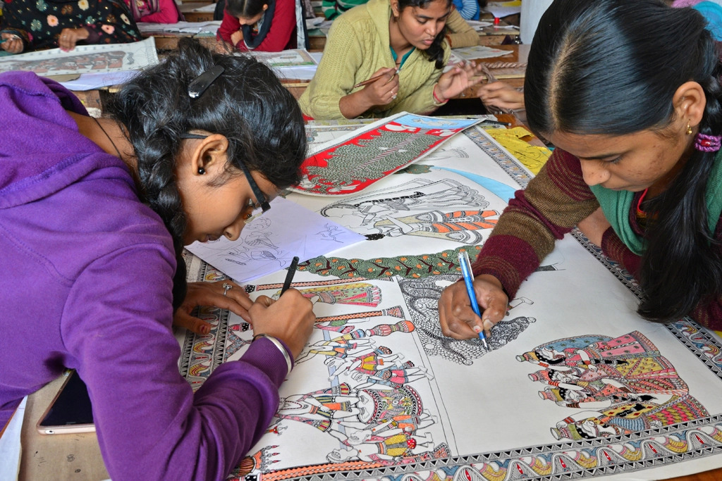 A group of girls drawing on paper AI-generated content may be incorrect.