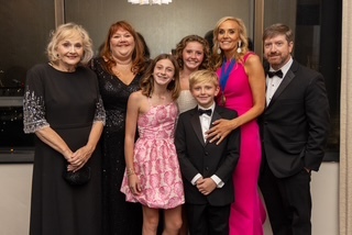 A group of people posing for a photo Description automatically generated