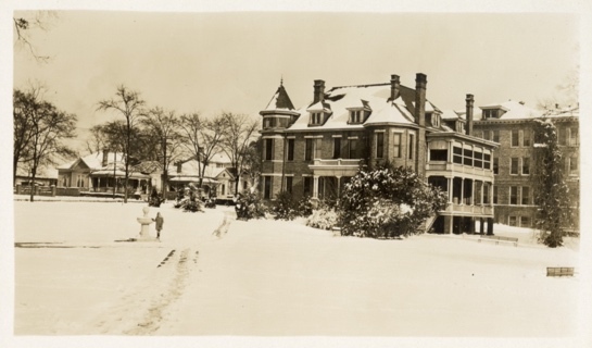 A house in the snow Description automatically generated