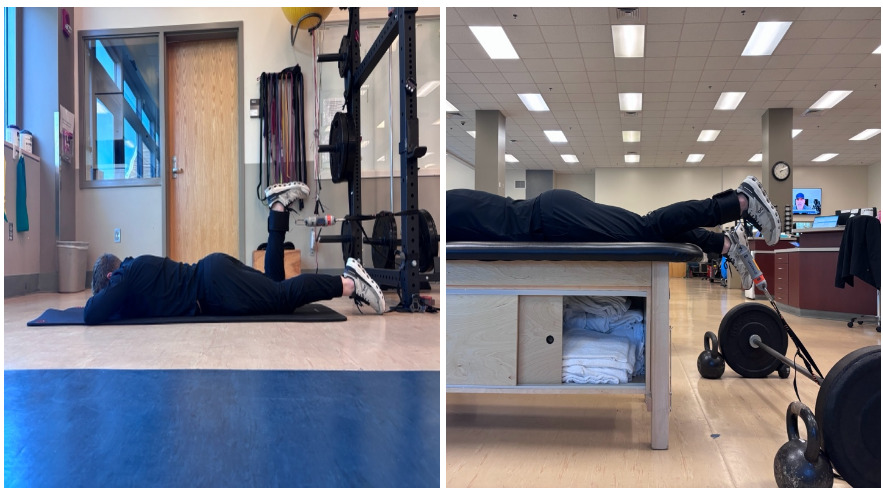 A person lying on a mat in a gym Description automatically generated