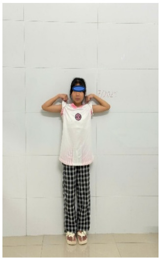 A child standing in front of a wall holding her shirt up AI-generated content may be incorrect.