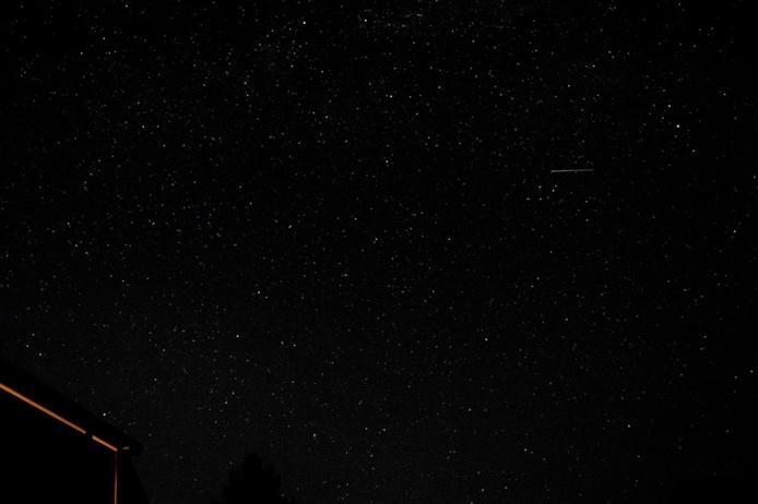 A building with a roof and a roof with a roof and a roof with a roof and a roof with a roof and a roof with a roof and a roof with a roof and a roof with Description automatically generated