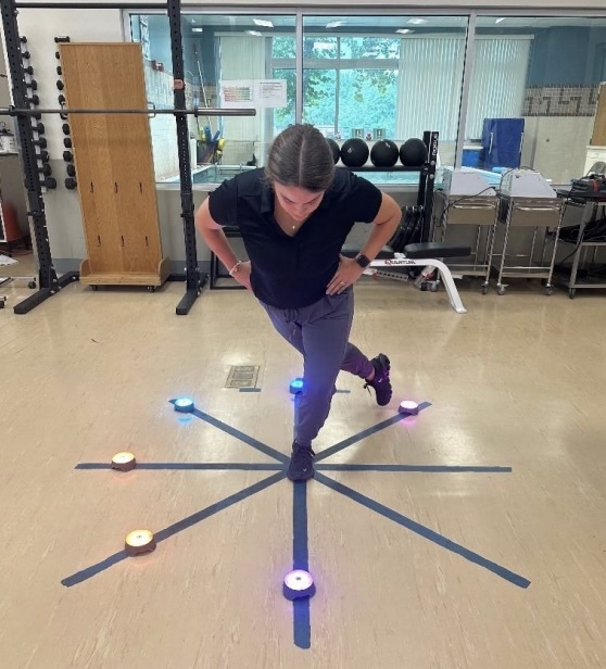 A person standing on a circle with lights on it AI-generated content may be incorrect.